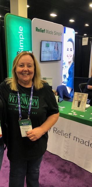 Vet Relief Support Staff Manager Wendi Kaminski at booth.